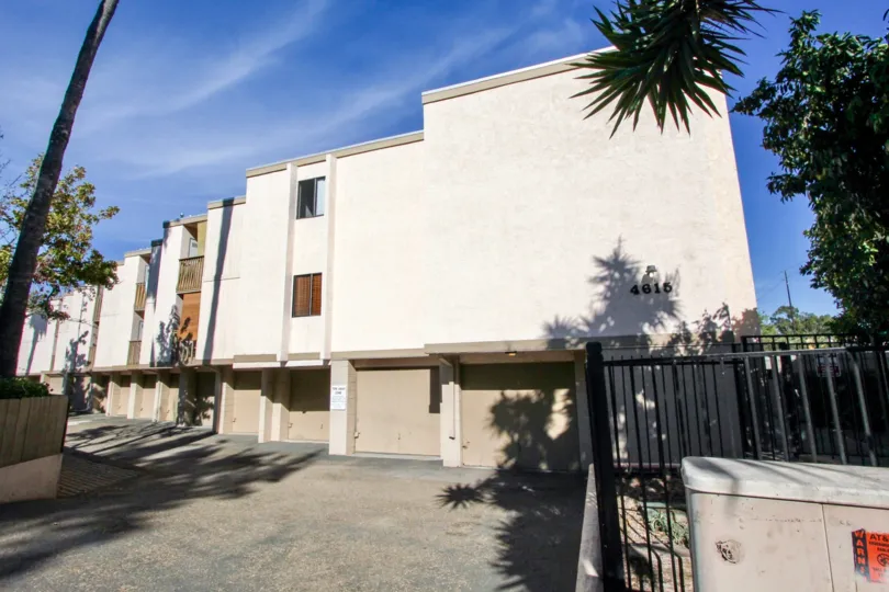 Rear view with secure garage parking at Rose Creek in Pacific Beach, California