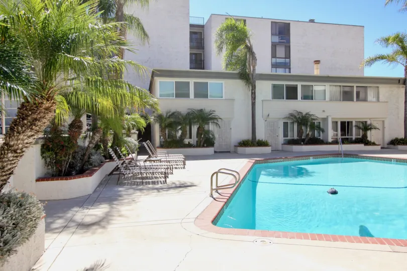 the Sail Bay Shores with large swimming pool and trees around