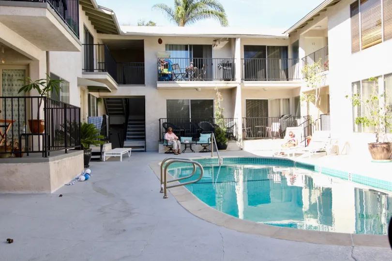 The Scott House with a swimming pool and chairs around
