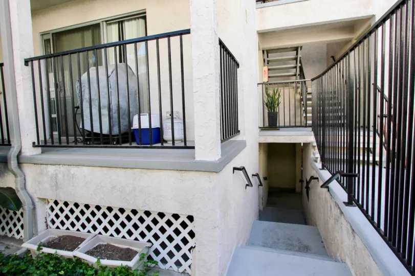 Porch with a fence and stairs in the Scott House Community in Pacific Beach, CA.