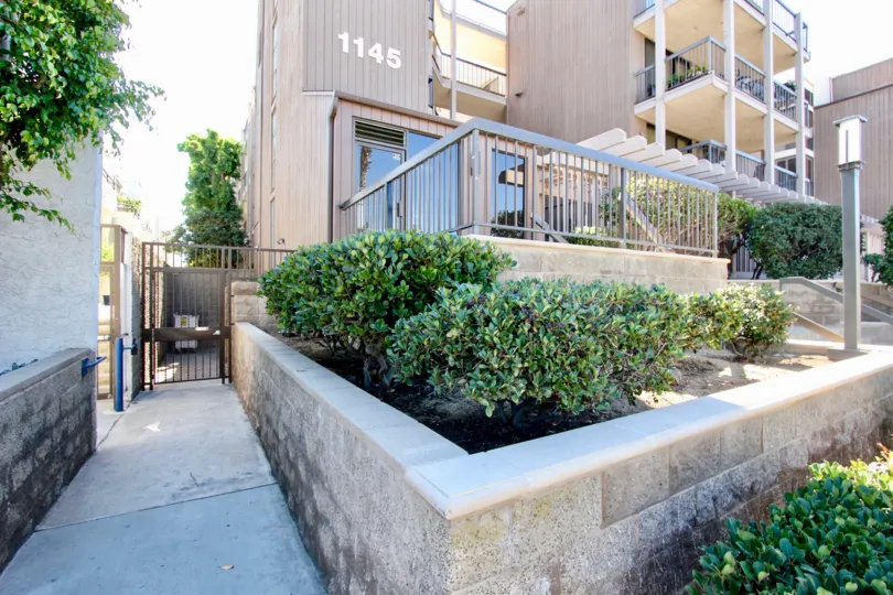 THE 1145 APARTMENT IN THE SANDERLING WITH THE BALCONIS, TABLES, PLANTS, TREES