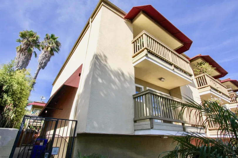 A three-storey townhomes with red eaves in the Sea2Bay community.