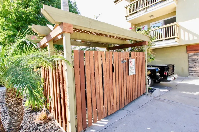 A sunny day in the area of Sea2Bay, truck, condo, balcony, wooden fence