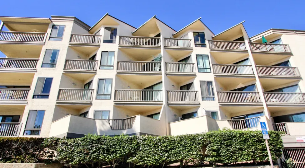 A sunny day in the area of See the Sea, outside, balconies, high ride, condos, bushes