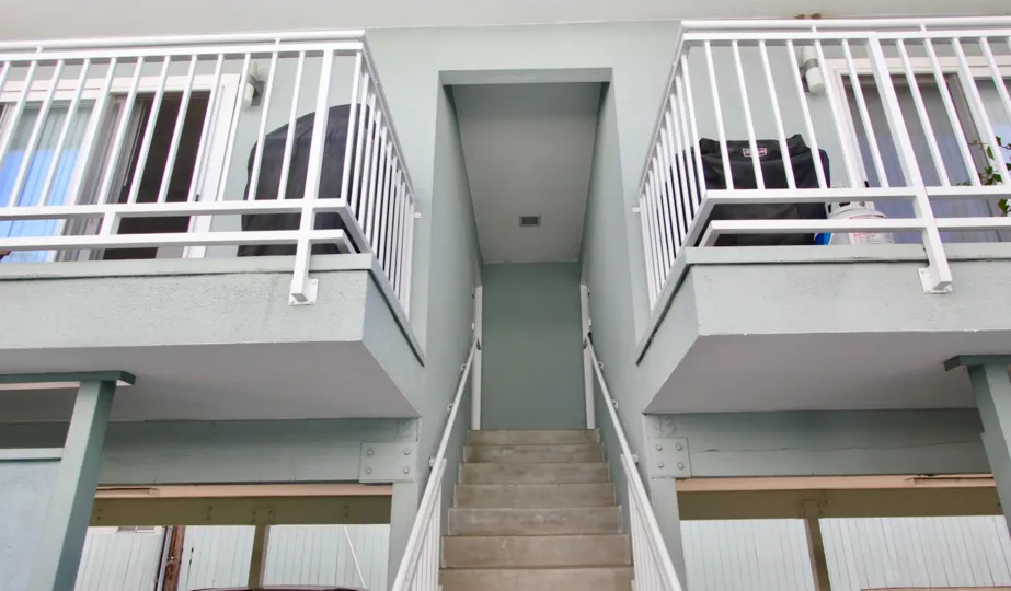 A sunny day in the area of The Heritage on Diamond, outside, sidewalk, balcony, stairs,