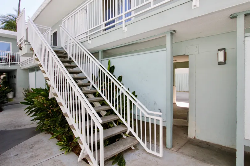 A sunny day in the area of The Heritage on Diamond, outside, sidewalk, stairs, condo