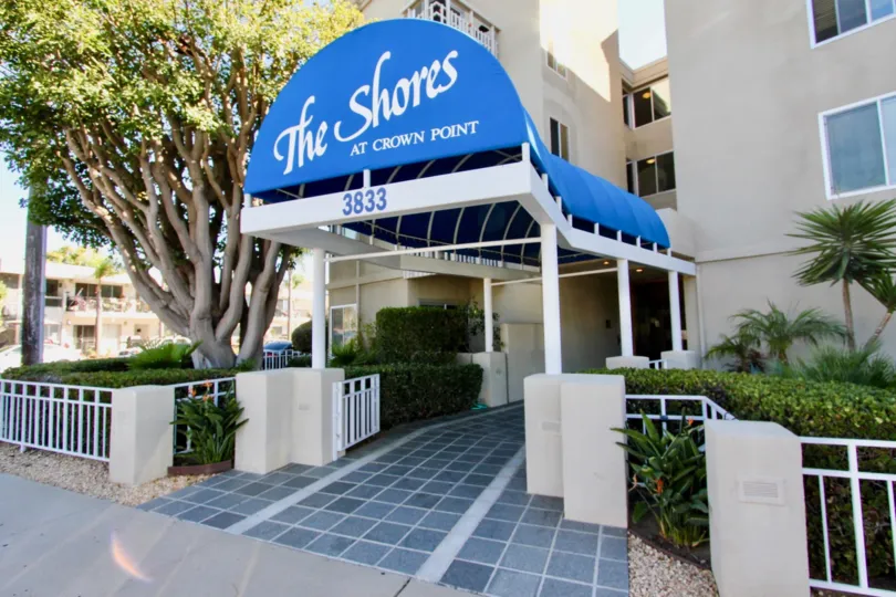 a sunny day in the shores at crown point with a building that named it and numbered as 3833