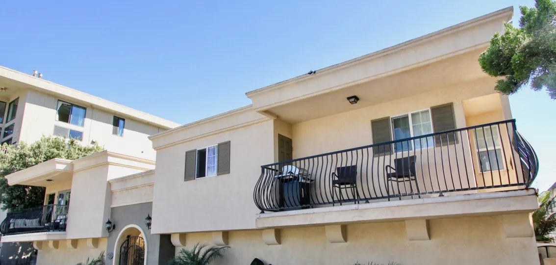 A sunny day in the area of Thomas Avenue Condominiums, ouside, grill, balcony, chairs, condo