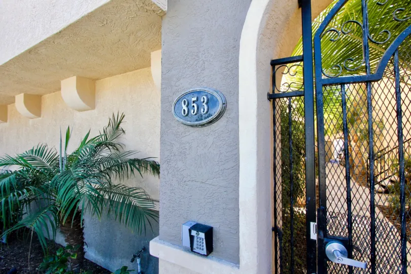 The gated security entrance to 853 Thomas Avenue Condominiums in Pacific Beach, California