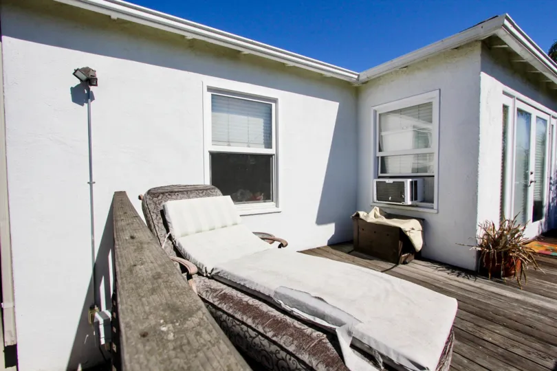 On a sunny day in Utopia, a Villa has flower pot and Sleeping bed