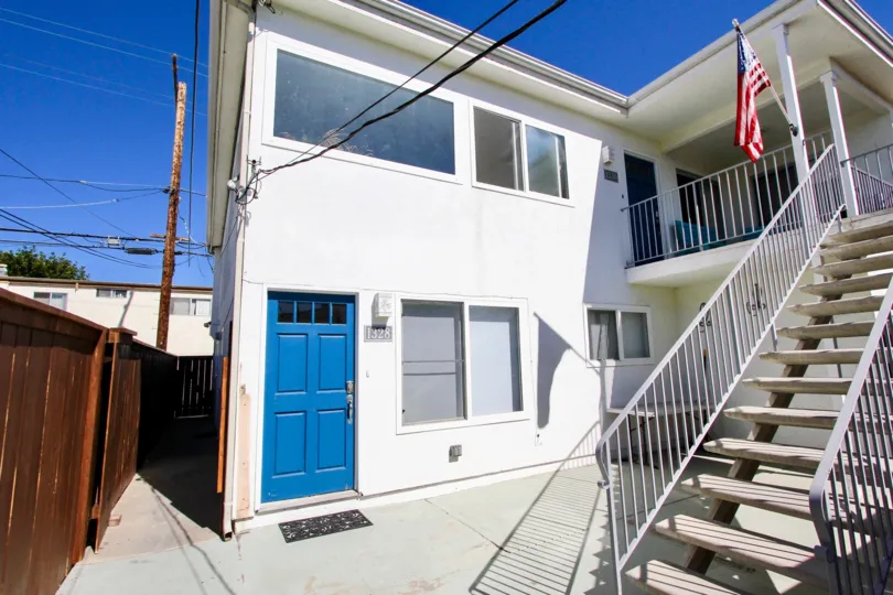 A stair case showing USA flag in a house in Utopia of Pacific Beach
