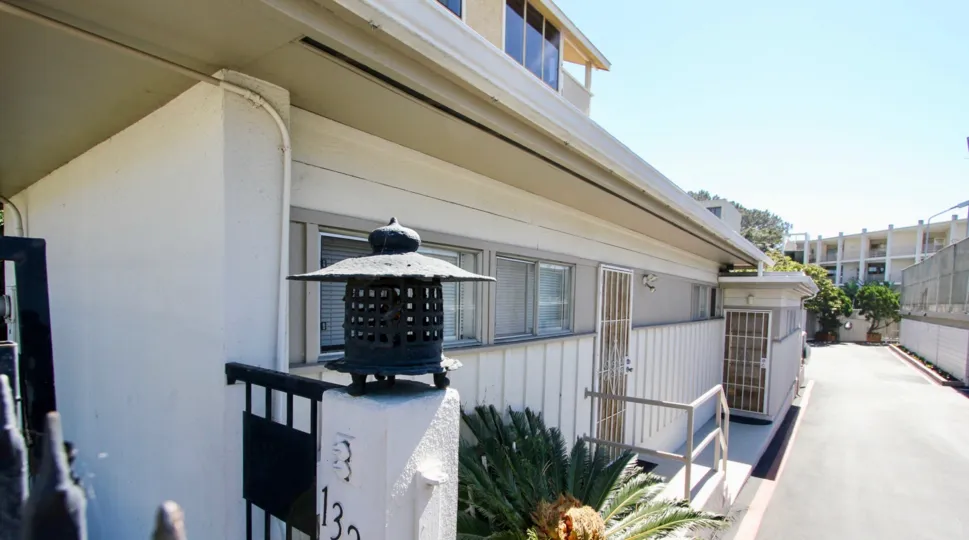A sunny day in the area of Villa Vacanza, outside, door, condo, sidewalk, fence, bush