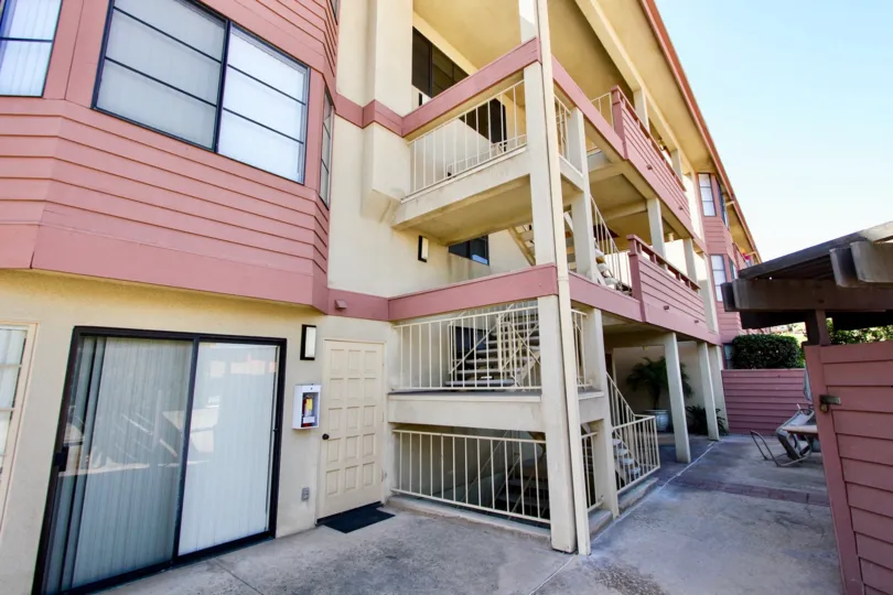 A salmon colored apartment in a shade setting in Addison Street.