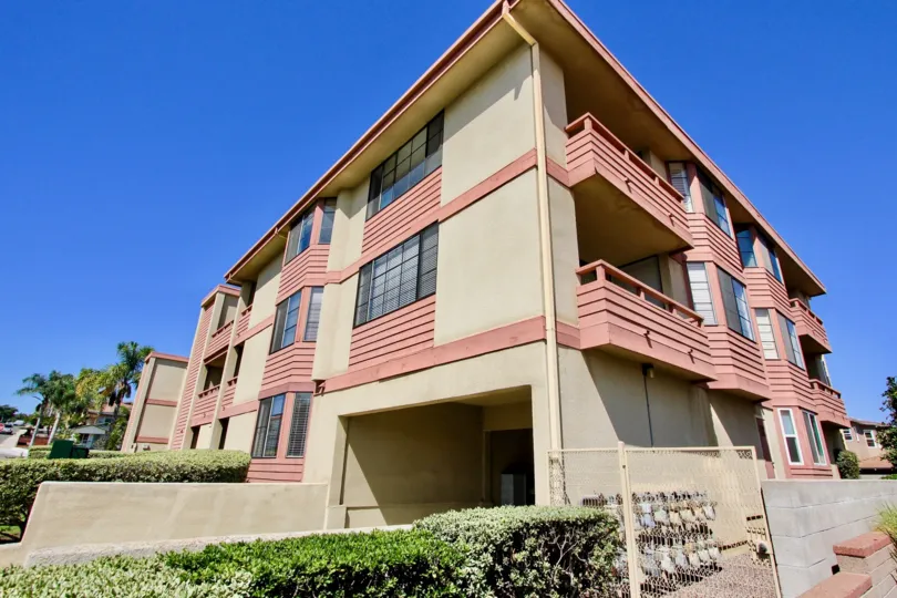 Addisoton Street apartment complex in Point Loma, CA on a sunny day.