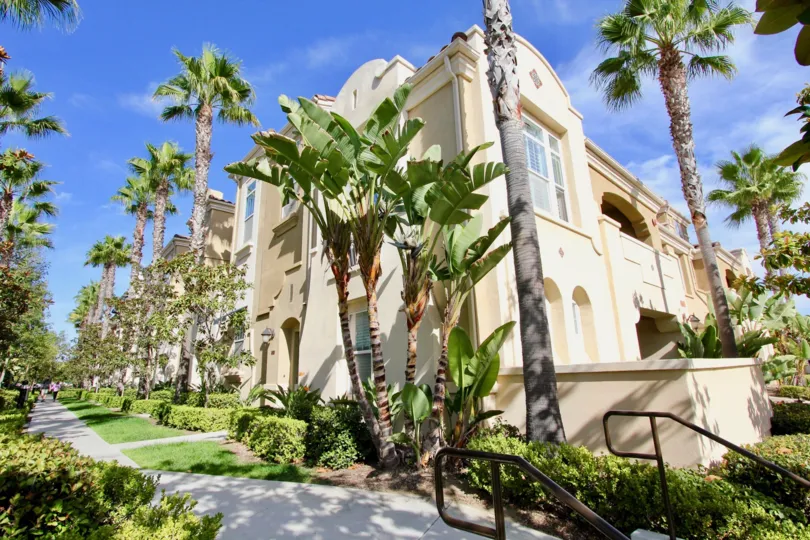 Gorgeous professionally landscaped exterior with tall mature palms and well maintained lawns at Anchor Cove
