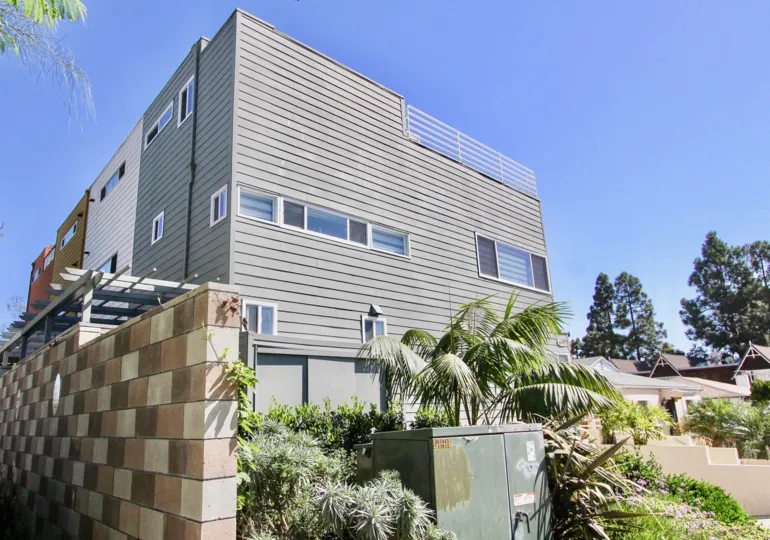 A bright exterior shot of the Harbor View Townhomes