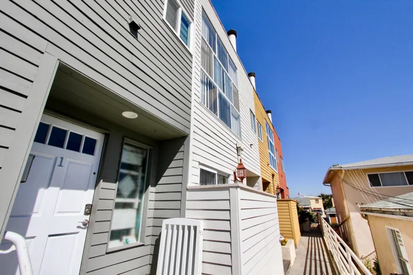 A doorway to an apartment in Harbor View Townhomes in Point Loma, Ca on a sunny day.