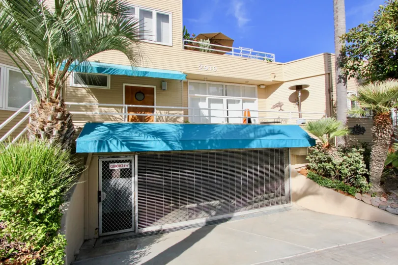 Shuttered garage with secured entrance below unit at La Playa Cove in Point Loma, CA