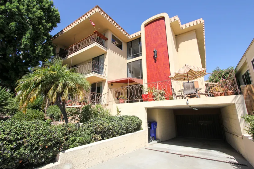 A red tiled section of a wall on a building at LaPlaya Plaza