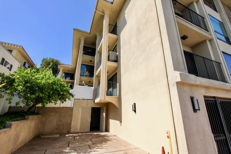 Top angle view of the building balcony surrounding with trees in La Playa Towers