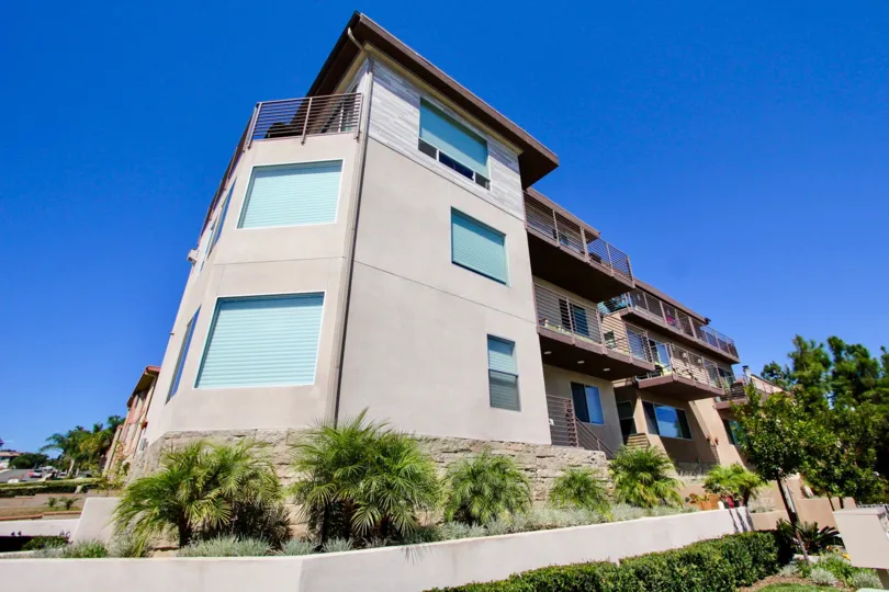 View of the front of apartment building in Portugal Place in Point Loma, Ca on a sunny day.