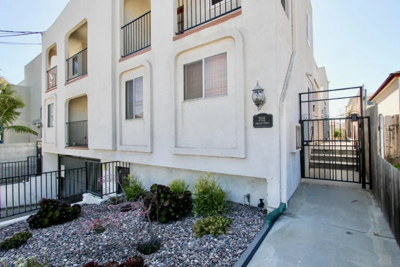 Side gate view of Primrose Gardens community house in Point Loma, California