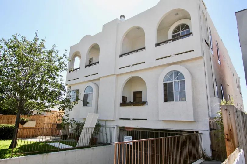 A large building with huge arches over patios in Primrose Villas at Point Loma CA