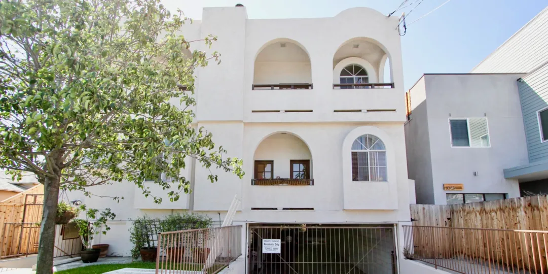 A bright exterior shot of Primrose Villas a gated looking community