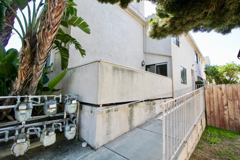 Handicap access ramp next to gas meters and greenspace at Roseville Terrace