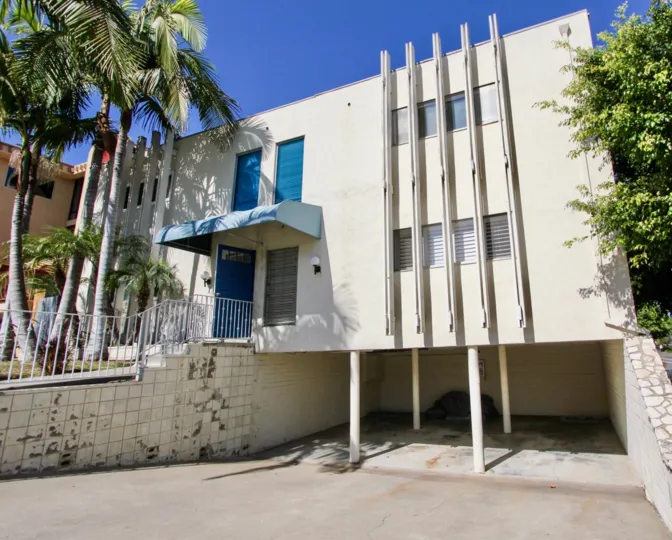 front entrance deco0rated with trees and plants and flowers in front of the building in Seair