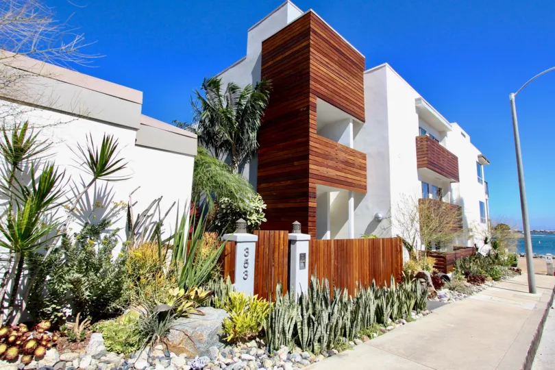A bright shot of Vista Del Bahia featuring bright shrubbery and woodwork.