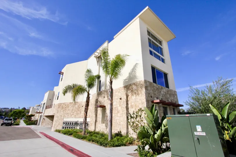 A brightly lit exterior shot of the Waterpoint Community In point Loma