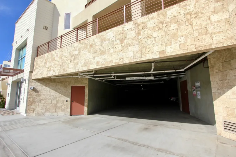 A marble facing above a dark parking garage at Waterpoint in Point Loma CA