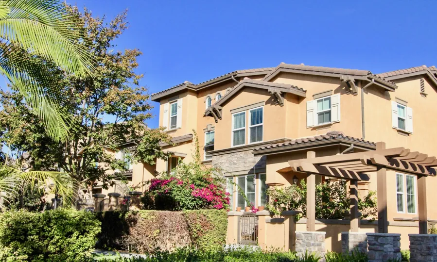 A big beautiful house which covered with garden and a beautiful flowers