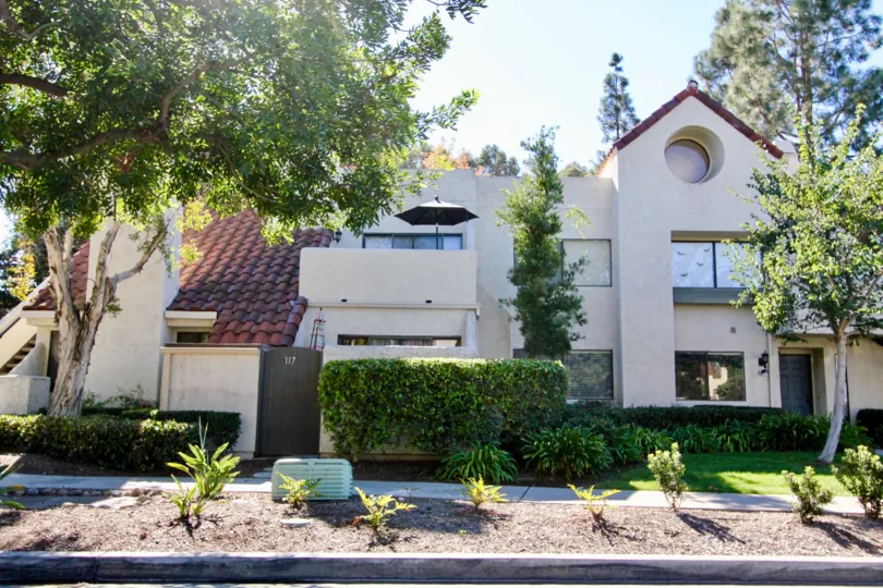 Two story housing with plants at Bernardo Pines in Rancho Bernardo CA