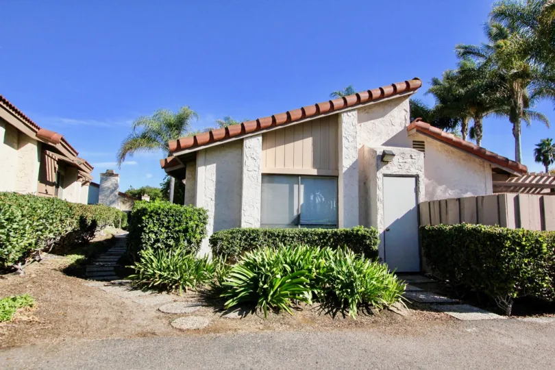 A villa in Bernardo Terrace has pathway along the side with grass