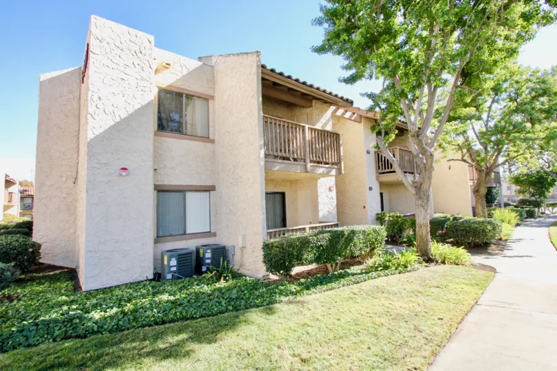Two story brown units with trees inside Bernardo Terrace in Rancho Bernardo CA