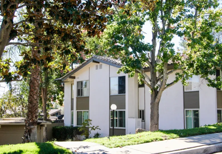 Two story town homes with trees and grass at Bernardo Village Green in Rancho Bernardo CA