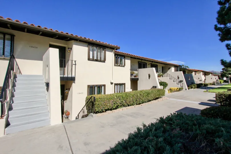 Spanish style apartments with tiled roofs and nice landscaping at Bernardo Villas in Rancho Bernardo, CA.