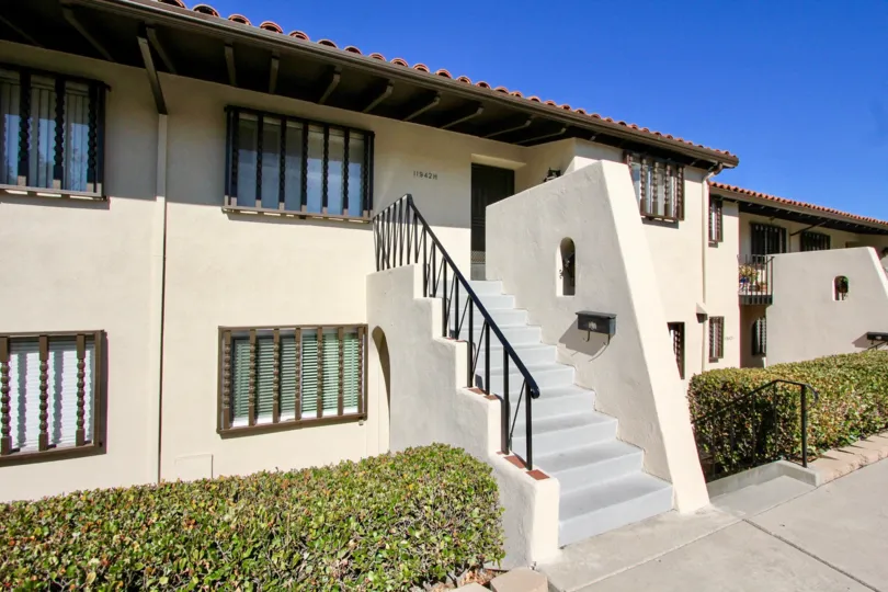 Two story housing with gray stairway at Bernardo Villas in Rancho Bernardo California