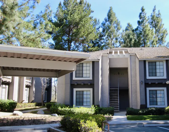 A view of the Carmel Trails Community on a sunny day with a blue sky.