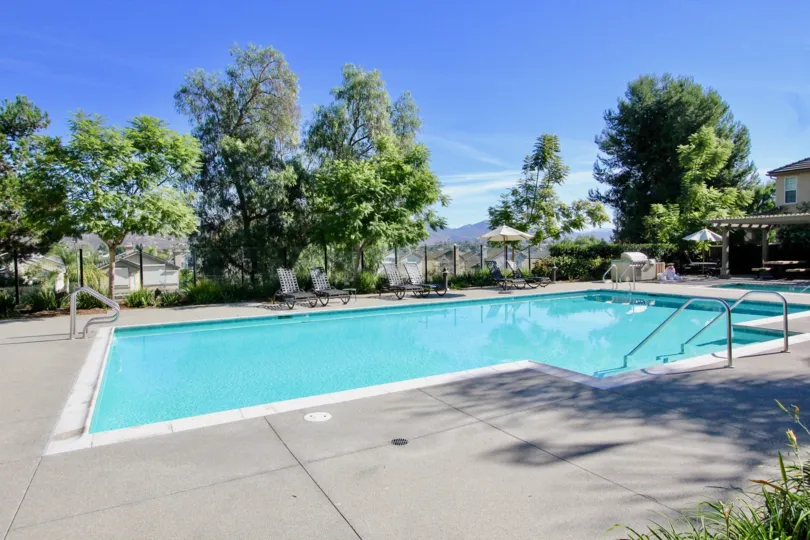 Swimming pool and chairs at Cypress Greensin Racho Bernardo CA