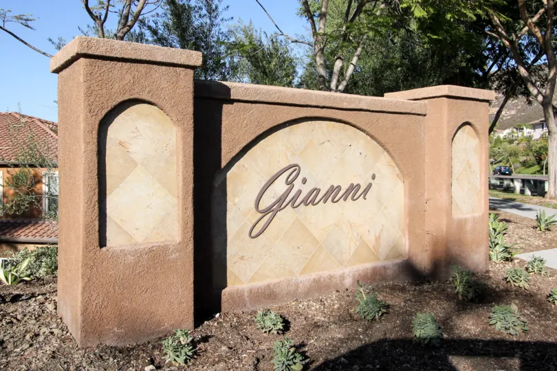 gianni monument describing the place name with a warm welcome sign.