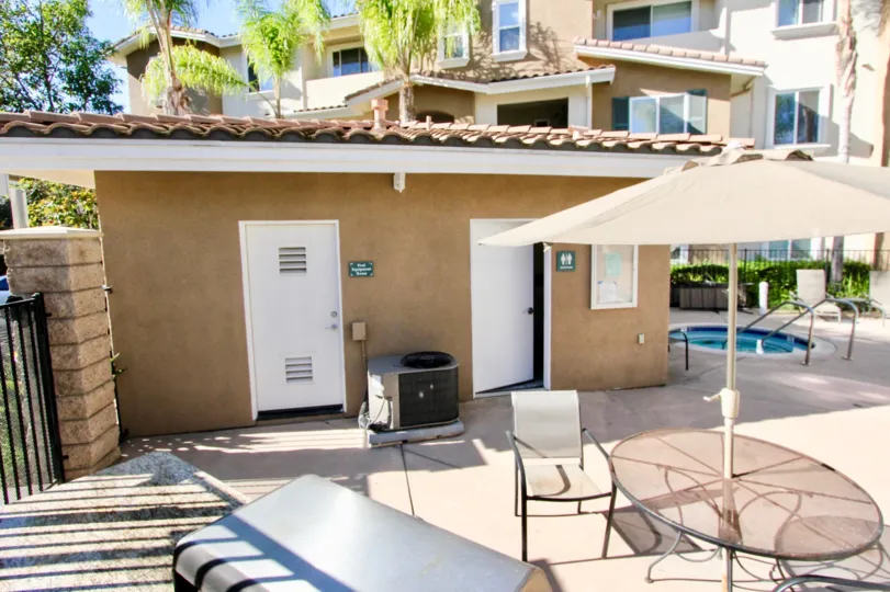 Pool area with sitting table at Heritage Villas in Rancho Bernardo CA