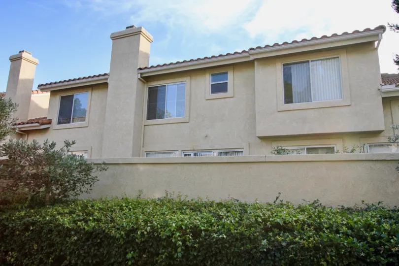 A back view of rental properties in La Cresta with bushes