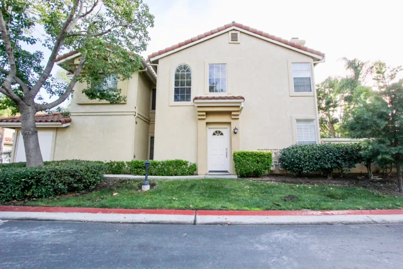Two story housing with white door inside La Cresta in Rancho Bernardo CA