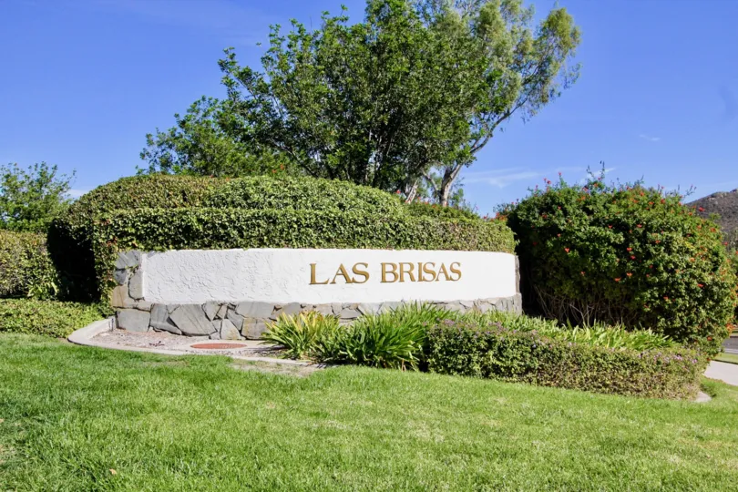 Beautiful greenery and sign in front of Las Brisas community in Rancho Bernardo, California.