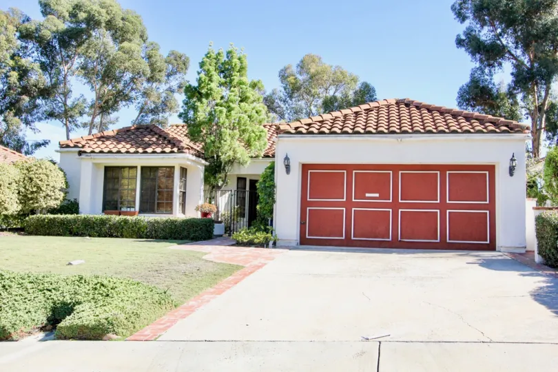 Red garage door on garage near residence at Las Brisas in Rancho Bernardo CA