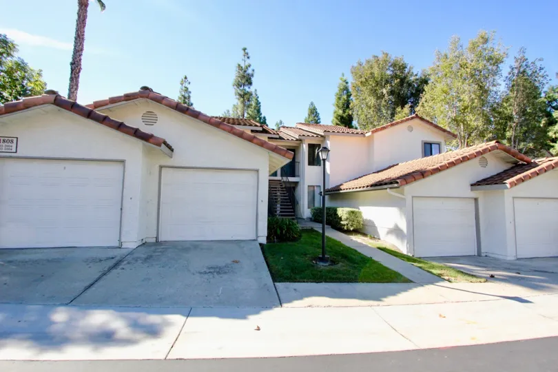Garages with pink roof tops and driveways at Lomas Bernardo in Rancho Bernardo CA