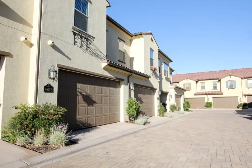 A row of properties with brick driveway in Mandolin